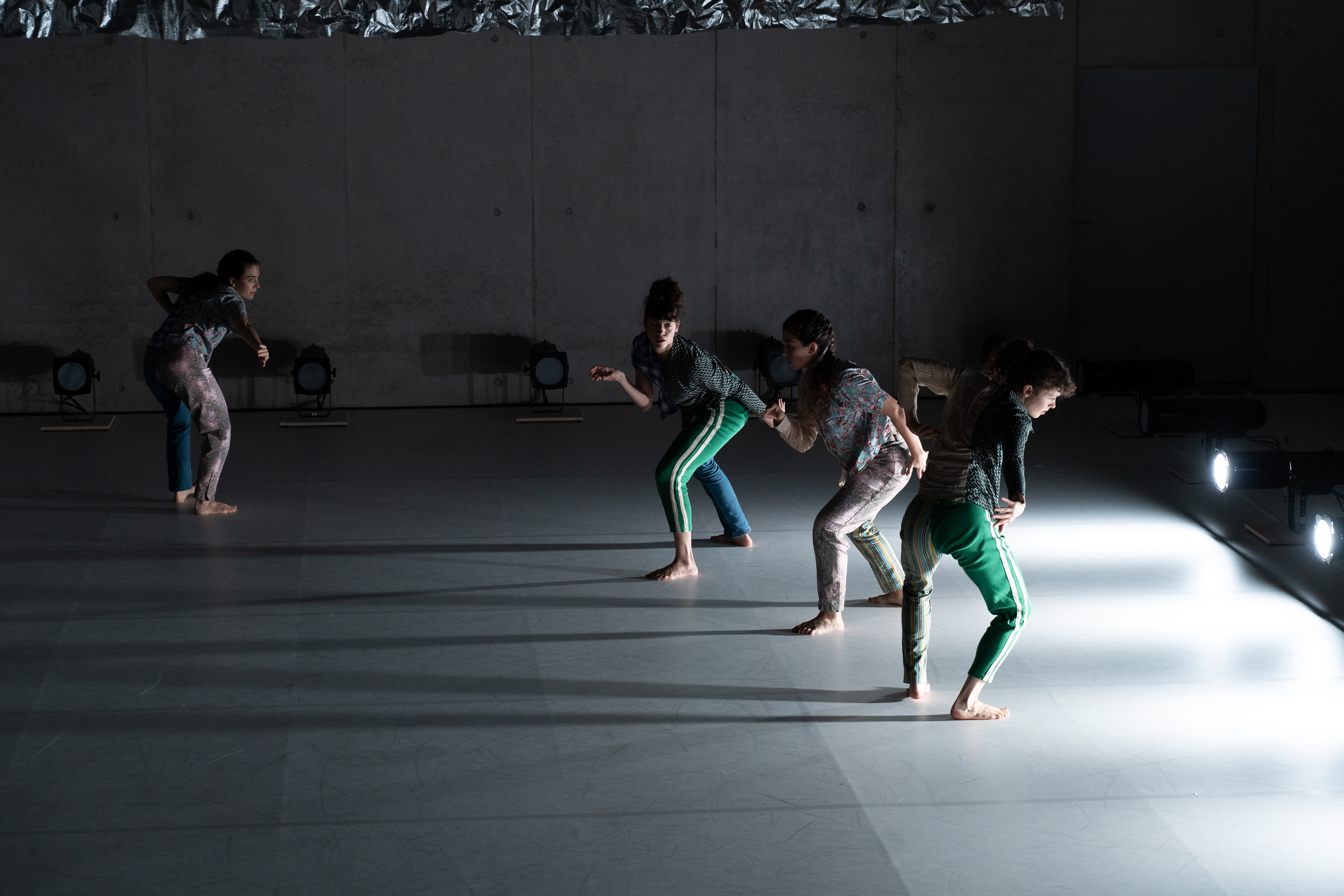 Matilda dancing next to sculpture